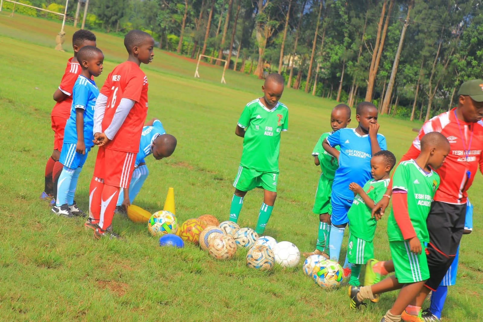 Tesh Football Academy members with their coach at Kisii school. Photo: Enock Okong'o.