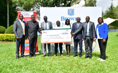 Representatives from Browns Plantations Kenya and the Browns and Finlays Community Trust present a dummy cheque for TVET scholarships to the 2026 cohort of 39 beneficiaries from Kericho and Bomet counties