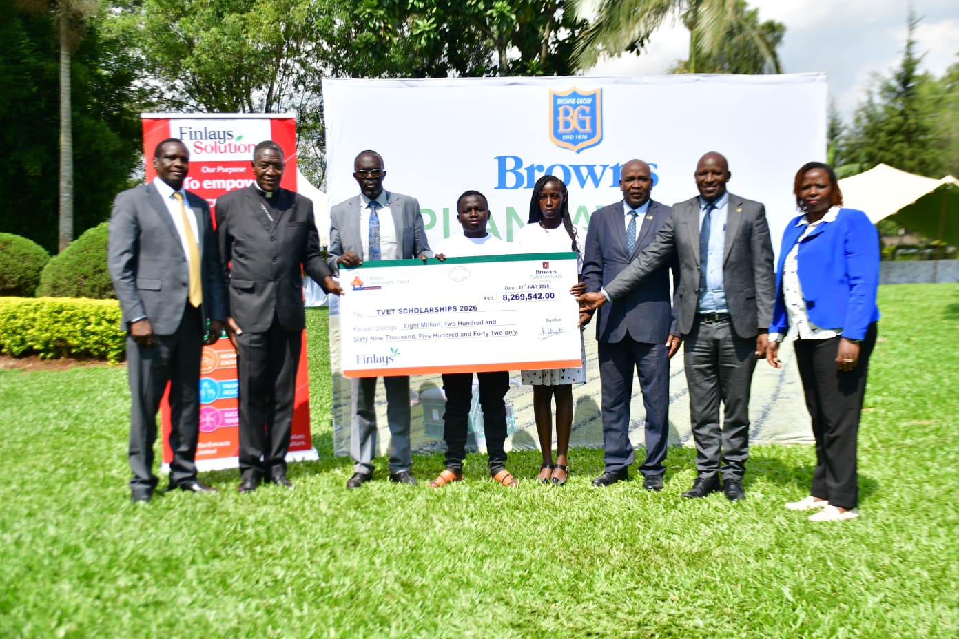 Representatives from Browns Plantations Kenya and the Browns and Finlays Community Trust present a dummy cheque for TVET scholarships to the 2026 cohort of 39 beneficiaries from Kericho and Bomet counties