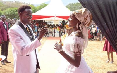 Turkana University ICT lecturer Nathan Ruto and his wife, Ruth Chepoghisho, during their colourful wedding ceremony held at Holy Rosary Girls Senior School in Ortum, West Pokot County