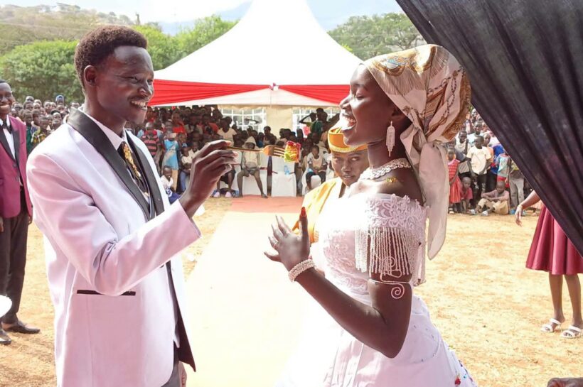 Turkana University ICT lecturer Nathan Ruto and his wife, Ruth Chepoghisho, during their colourful wedding ceremony held at Holy Rosary Girls Senior School in Ortum, West Pokot County