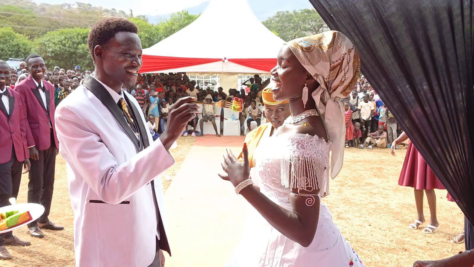 Turkana University ICT lecturer Nathan Ruto and his wife, Ruth Chepoghisho, during their colourful wedding ceremony held at Holy Rosary Girls Senior School in Ortum, West Pokot County
