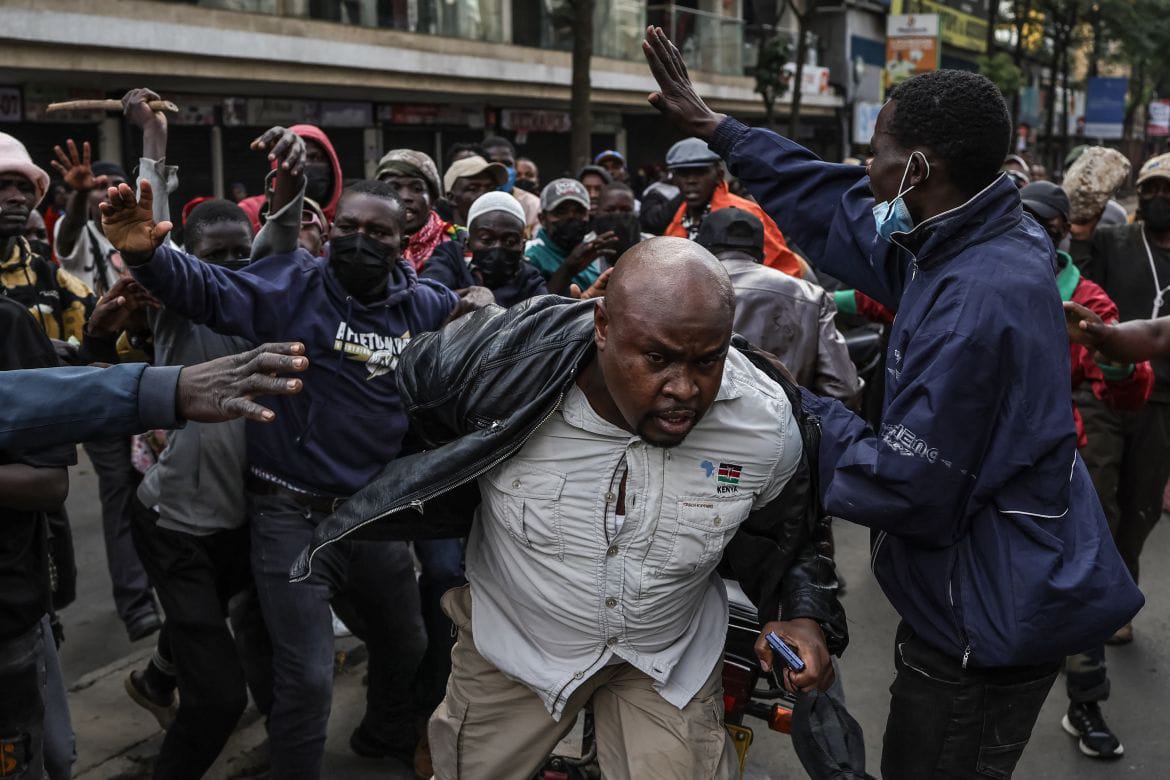 A person being mishandled at a past political rally. Teachers have been cautioned to avoid political rallies
