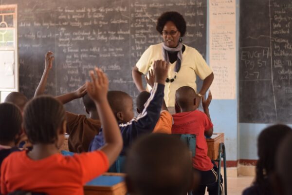 A teacher engages pupils in a classroom session, Heads of institutionss should remain at the centre of every decision made about their schools.