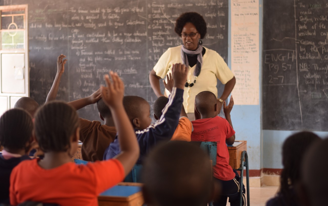 A teacher engages pupils in a classroom session, Heads of institutionss should remain at the centre of every decision made about their schools.