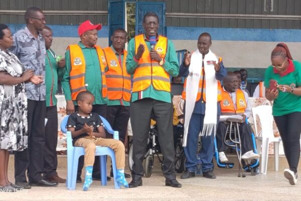 KNUT Secretary-General Collins Oyuu speaks during the inclusion event for teachers with disabilities at Bomet Green Stadium, where 163 teachers received assistive devices