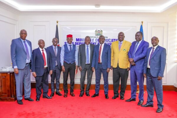 PS John Ololtuaa pose for a photo with national officials of the Kenya Union of Post Primary Education Teachers (KUPPET) after the consultative meeting