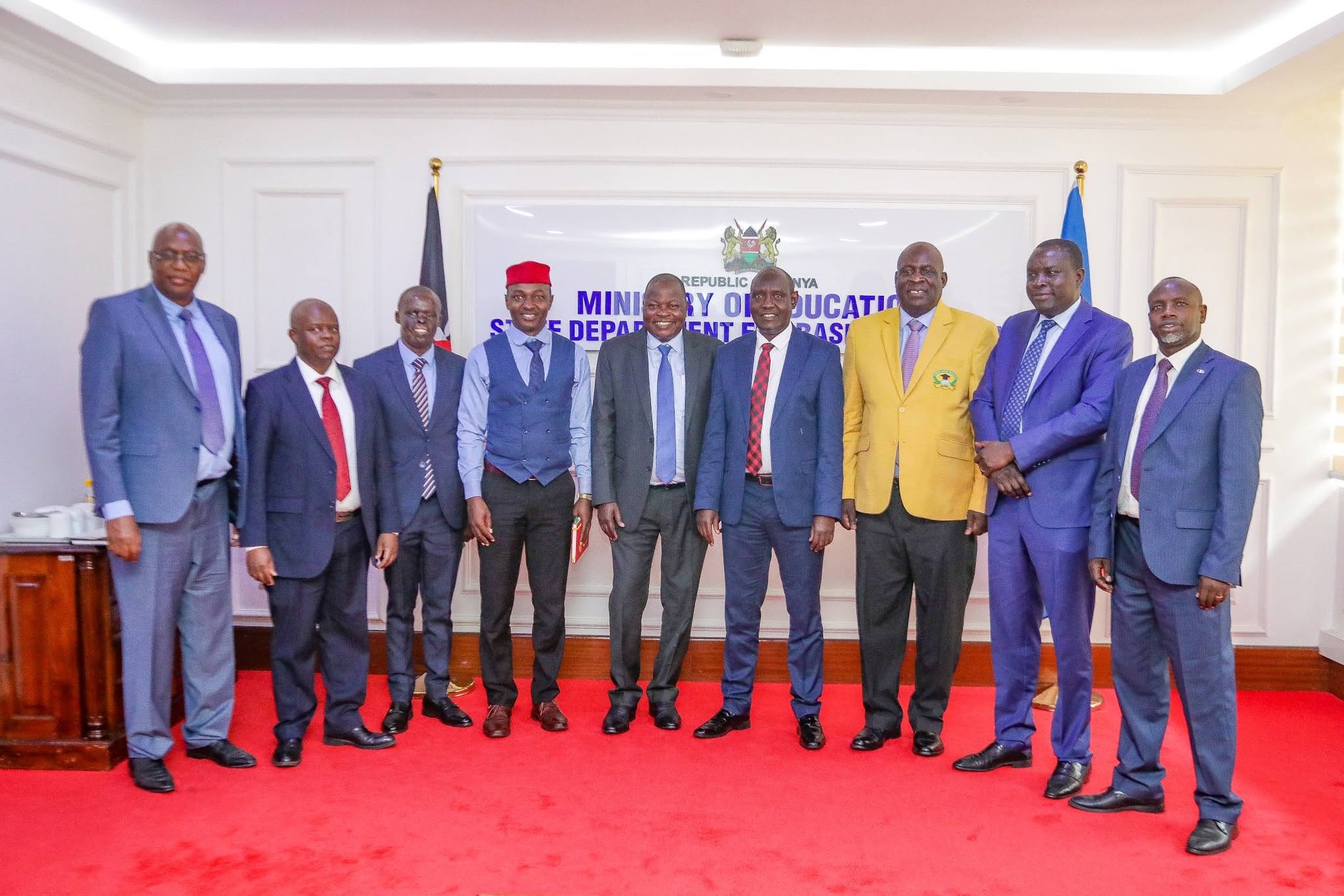 PS John Ololtuaa pose for a photo with national officials of the Kenya Union of Post Primary Education Teachers (KUPPET) after the consultative meeting