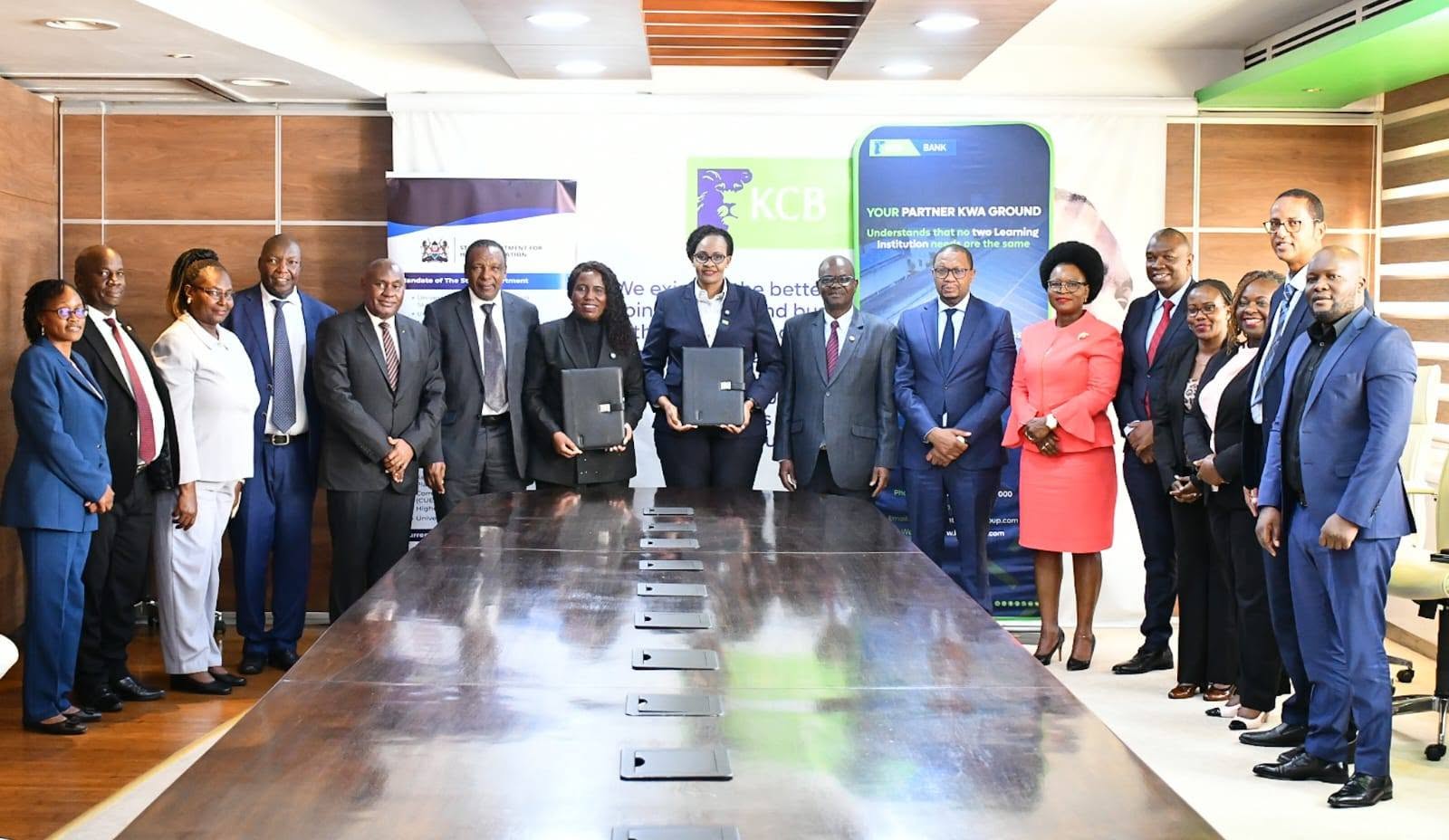 Principal Secretary Higher Education and Research, Dr. Beatrice Muganda Inyangala and other stakeholders during the signing of the MoU with KCB