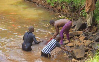 Bomet County disaster response divers retrieve the body of a Form Three student of Riokindo Boys High School from Nyakwana Falls in Kisii County during a recovery operation