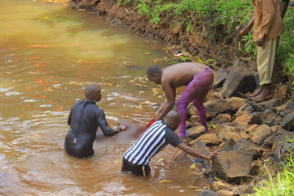 Bomet County disaster response divers retrieve the body of a Form Three student of Riokindo Boys High School from Nyakwana Falls in Kisii County during a recovery operation