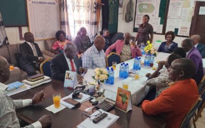 Chief Principal Clement Myang'acha( front right,) at his Kebirigo Senior School office with Principals from Nyamache Subcounty