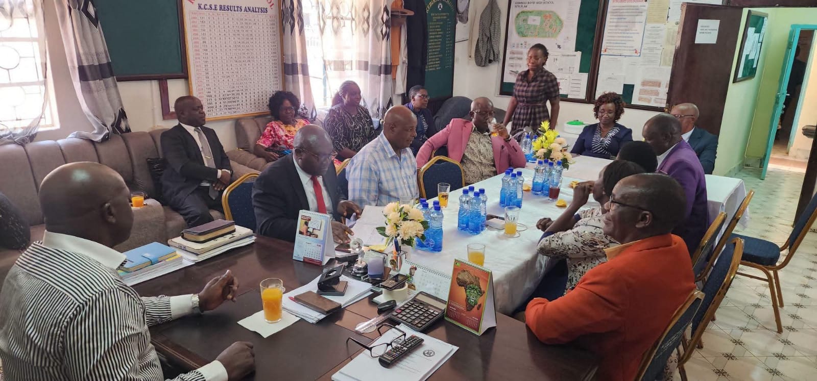 Chief Principal Clement Myang'acha( front right,) at his Kebirigo Senior School office with Principals from Nyamache Subcounty