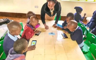 A tutor during an interactive Digital learning lesson at one of the ECDE Centres in Nyamira county