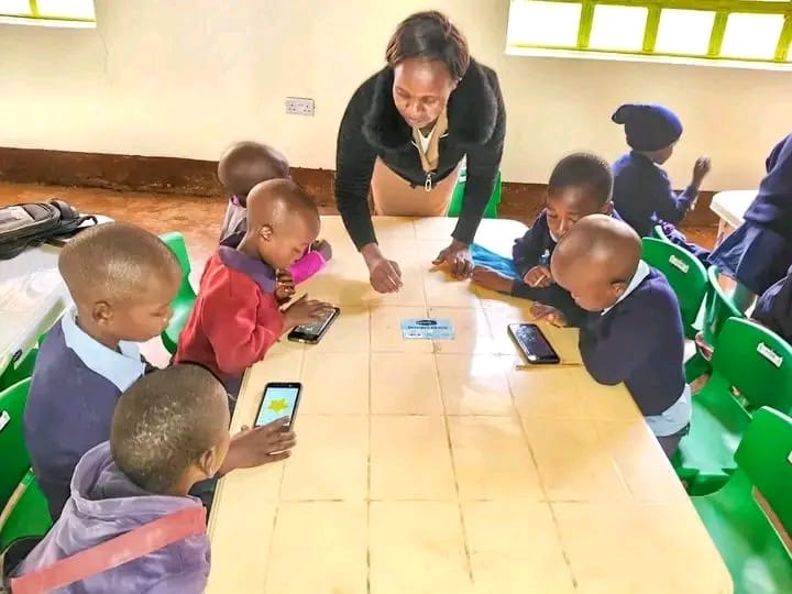 A tutor during an interactive Digital learning lesson at one of the ECDE Centres in Nyamira county