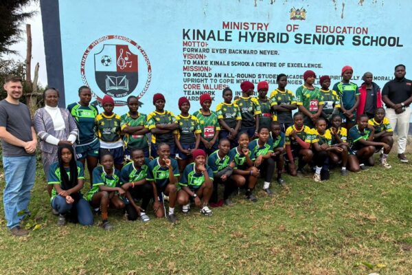 Kinale Hybrid Senior School rugby players pose for a photo with T5RA officials from Germany and Chief Principal Vulfrida Simiyu during a visit to the Kiambu County school following the launch of a partnership to promote rugby, education and international opportunities