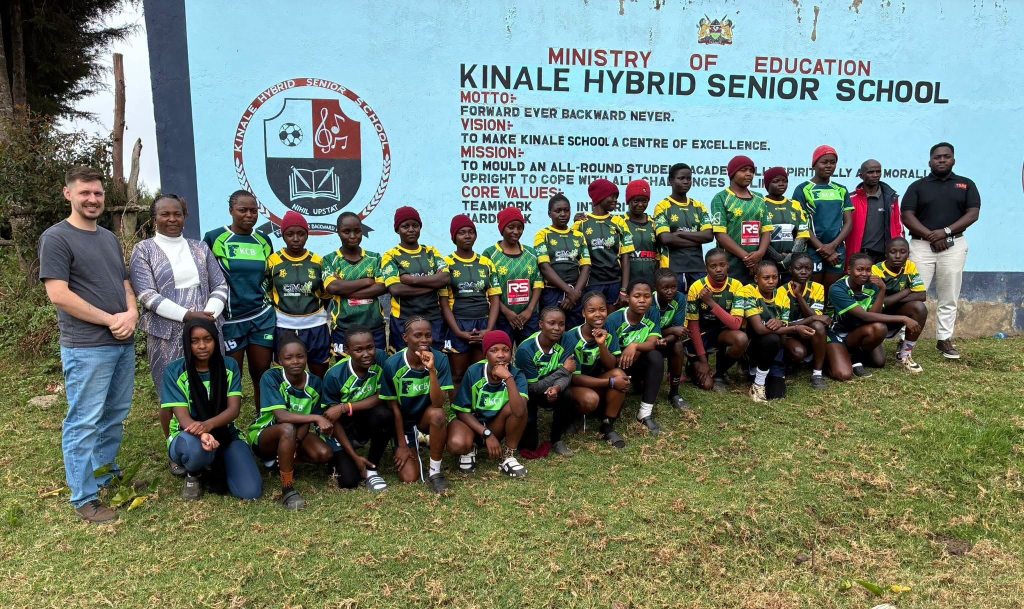 Kinale Hybrid Senior School rugby players pose for a photo with T5RA officials from Germany and Chief Principal Vulfrida Simiyu during a visit to the Kiambu County school following the launch of a partnership to promote rugby, education and international opportunities