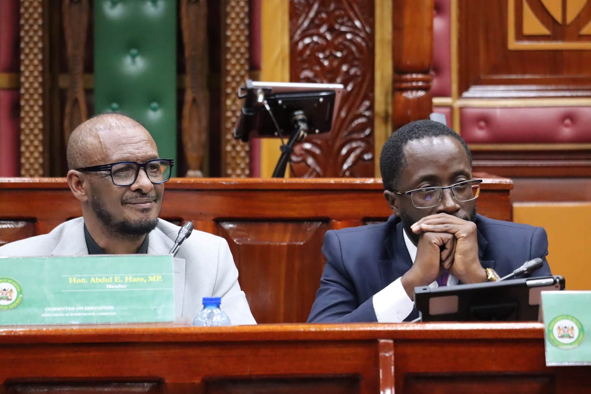 Mandera South MP Abdul Haro (R) and Kitutu Masaba MP Clive Gisairo during public participatipn for the Education reform Bills at County Hall, Nairobi
