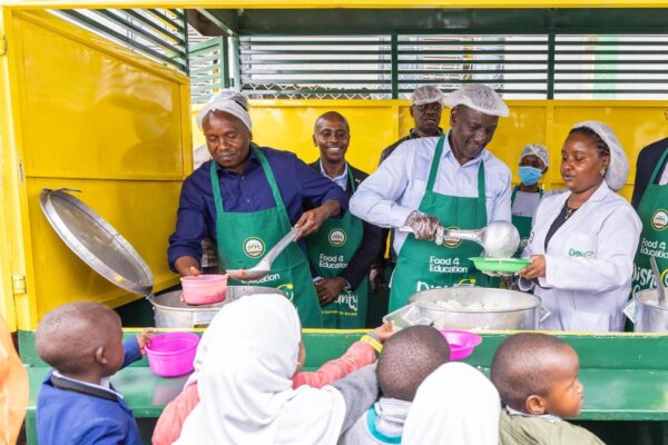 President William Ruto and Deputy President Kithuer Kindiki serve lunch to children during the opening of Dishi na County Central Kitchen on March 10, 2025