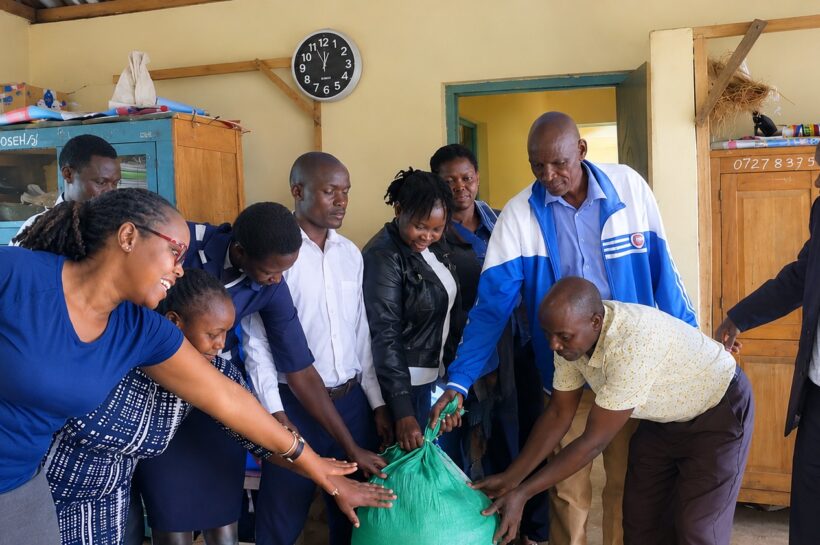 MCA Ondari Sonye (second right bending)at Riamarube Comprehensive School. Photo: Enock Okong'o